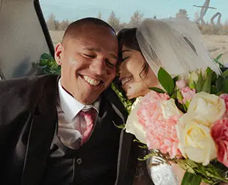 Couple in a car after their wedding