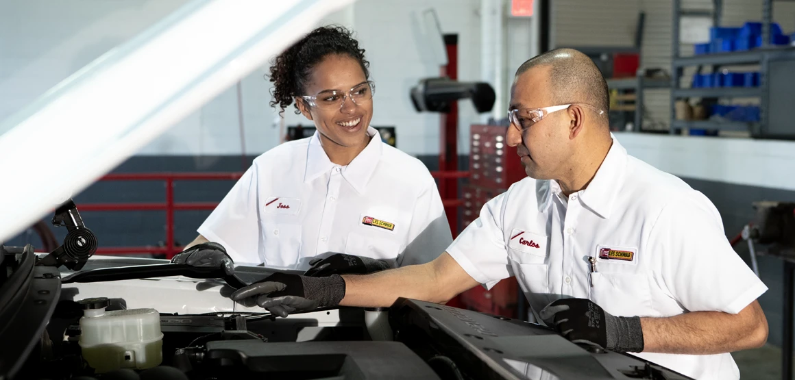 Technicians working on a battery