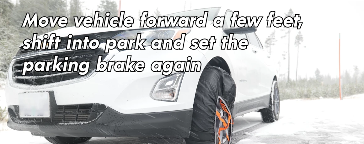 Vehicle equipped with tire socks moves forward to adjust fit.