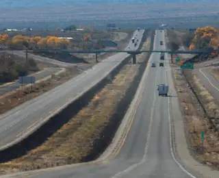 Divided freeway with cars in the distance