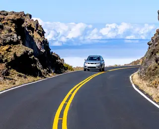 Car driving on coastal highway