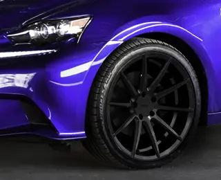 Black rim on purple/blue car